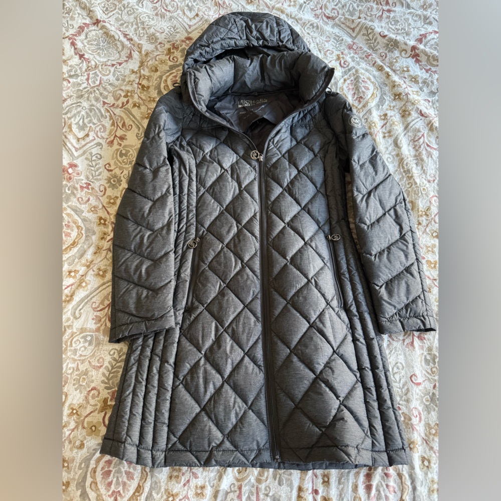 Gray Michale Kors packable down jacket. Hits mid thigh.